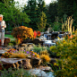 Design ideas for a large southwestern full sun backyard stone landscaping in Seattle.