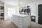 Walk-in closet - large transitional gender-neutral carpeted and beige floor walk-in closet idea in Phoenix with shaker cabinets and white cabinets