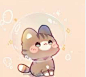 a cute little cat sitting in front of a bubble
