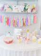 A pretty pastel unicorn first birthday party including pastel unicorn tassel garland rainbow punch pastel unicorn candy bar and many more unicorn centerpiece ideas and unicorn backdrop ideas for unicorn party ideas on a budget