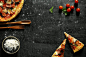 messy-pizza-on-a-black-table