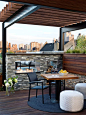 A steel and wood pergola is pitch perfect for this urban setting. Overlooking the Chicago skyline, the contemporary rooftop deck blends clean lines with rustic and industrial elements.