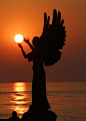 Angel Holding The Sunset
