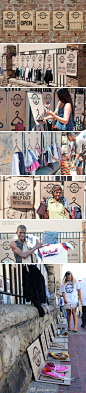 【流浪者专属的shopping street】在南非，超过一半的人身处贫困之中，吃不饱穿不暖甚至流浪街头。非洲广告公司M&C Saatchi Abel发起一项“The Street Store”计划，捐助者通过网络下载打印海报衣架，集中挂在某个街头，一条旧货市场应运而生。让贫困的人们在领取捐助的时候也能体会到逛街的乐趣。