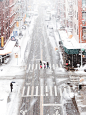 people crossing the street while snow raining