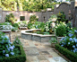 Photo of a traditional backyard formal garden in Atlanta with natural stone pavers.