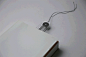 illuminated bookmark uses an interwoven circuit | Designboom Shop : ‘bookmark light’ is a multifunctional bookmark printed on a special film using the ink which transmits electricity.   It can use as a bookmark, also can be used as illumination to use a l