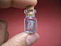 Artist Akinobu is known for making miniature sculptures in glass bottles. His work is available for sale at Etsy.: 