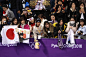 Spectators throw flowers and Winnie the Pooh toys on the ice after Japan's Yuzuru Hanyu performance during the men's free skating event at the 2018...