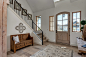 Inspiration for a timeless light wood floor and beige floor entryway remodel in Boise with white walls and a light wood front door