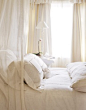 White bedding + canopy.