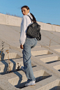 Our small women's backpack is the perfect choice for the stylish and practical woman on the go. With its compact design and multiple compartments, this backpack offers plenty of room for all your essentials while still remaining lightweight and easy to ca