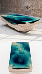 Another table that takes its inspiration from nature. The way the table is cut, it almost appears as if a puddle of clear blue water is suspended in the piece.: 