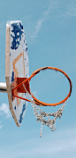 white and blue portable hoop under blue sky