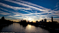 Rush hour: Globalized transportation networks, especially commercial aviation, are a major contributor of air pollution and greenhouse gas emissions. Photo of contrails in the west London sky over the River Thames, London, England