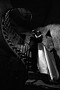 Black and White Photo Bride and Groom Inside Castle Created a Heart Shape With Lighting