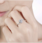 新款时尚18k金莫桑钻石婚戒精致六爪交叉扭臂微镶仿真D色戒指-淘宝网