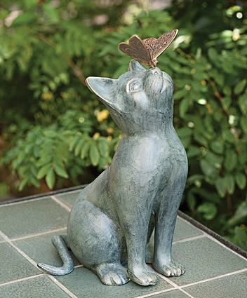 Cat  statue  with Bu...