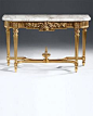 Louis XVI style | console | Louis XVI style carved wood console with floral motif, antique gold leaf finish and Calacatta gold marble top with carved beveled edge