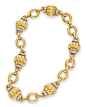 A GOLD AND DIAMOND NECKLACE, BY DAVID WEBB  Designed as a series of fluted 18k gold bombé links, flanked on either side by circular-cut diamond arched bands, spaced by polished 18k gold oval-shaped links, mounted in 18k gold and platinum, 18½ ins., (may a