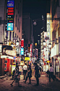 the streets of downtown Tokyo abuzz with nightlife, Japan