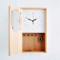 Beautifully useful. This graceful, beech wood clock can affix to a wall or hold its own on a shelf. A hidden compartment for up to five sets of keys, and a space for phones, trinkets or to-do lists, makes it a godsend for neatniks.: 