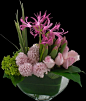 pink nerine lilies, hyacinths, roses and tulips with lush green hydrangea and foliage in our leaf-lined demilune vase