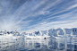 View of a polar research vessel, a large boat in an inlet. by Mint Images on 500px