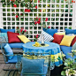 Lattice panels screen wind and lend privacy to this deck while flowering climbers soften their look and add color. | Photo: Jerry Pavia | thisoldhouse.com: 