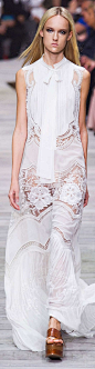 Roberto Cavalli Collection Spring 2015..too bad the model isn't having any fun wearing this beautiful lace dress: 