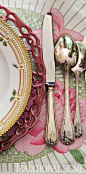 Silver monogrammed flatware is from Christofle.  Saint-Tropez-Inspired Dinner | Traditional Home