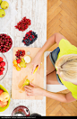 Mature woman preparing a smoothie - stock photo