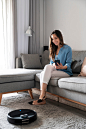 Full shot woman sitting on couch