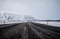 柏油路与冰雪山峦风光摄影高清图片