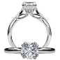 Modern diamond engagement ring featuring a double prong set round cut center stone with micropavé diamonds on the undergallery and a solid metal shank.