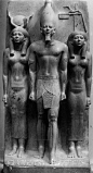 st1mu11:<br/>King Menkaure (Mycerinus) between the goddess Hathor and the goddess of Diospolis Parva, green slate, h: 37.25”, Dynasty IV, Old Kingdom.<br/>