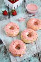 Baked Donuts made with refrigerated biscuits and drizzled with easy and delicious strawberry glaze!