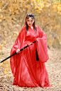 Young beautiful asian woman dress in traditional Chinese old fashion warrior style with ancient word