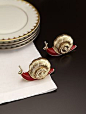 These salt and pepper shakers are a great present for the hostess with style. L'Objet Gold Snail Salt & Pepper Shakers