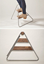 This step ladder is designed to hang on the wall like a piece of art: 