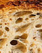 This may contain: closeup of bread with holes in it and some other things on the top surface