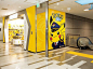This may contain: the entrance to a pokemon store is decorated in yellow and gray colors with an image of pikachu on it