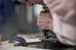 Cropped shot of senior carpenter using jigsaw tool in workshop