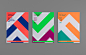 three books with different colors on them sitting next to each other in front of a gray background