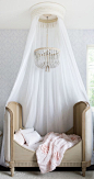 canopy bed & chandelier // little girls' pink & white bedroom: