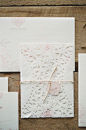 Here's a closer look at the doily-styled invitation wrap. Beautiful! Invitations by uniqlove.com / Photography by emilysteffen.com