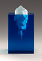 What about an "iceberg" that's really a woman? Cast glass floating woman with trailing hair, blue resin "water".