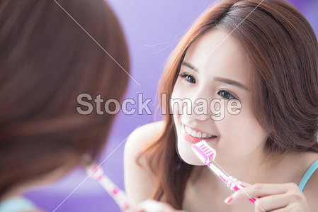  woman brushing  tee...