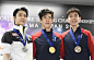 Nathan Chen of the United States poses for photos after winning the men's title at the world figure skating championships at Saitama Super Arena near...