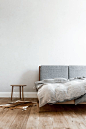 || Loft Szczecin | House in Berlin . Amazing timber frame bed with grey cushioned bedhead. Styled with linen sheets